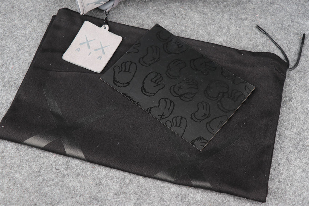 KAWS x Air Jordan 4 Retro 'Cool Grey' Sample